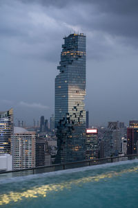 Mahanakhon tower in bangkok seen from apartment pool.