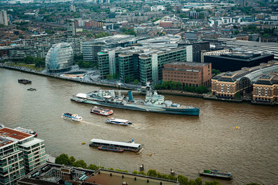 High angle view of river amidst buildings in city