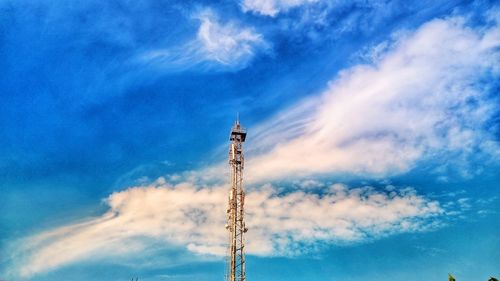 Low angle view of communications tower against sky