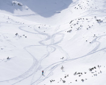 Ski alpinist roaming through alpine valley full of snow, slovakia, europe