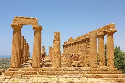 Old ruins of temple against clear sky