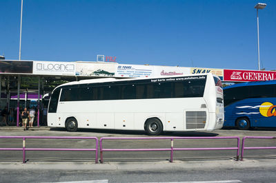 Cars on road against blue sky