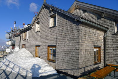 Low angle view of building against blue sky