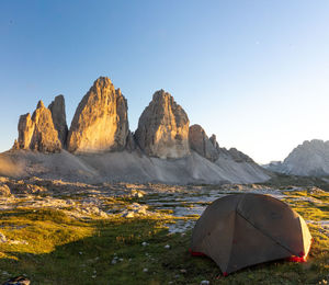 Panoramic view of rocks and mountains against clear sky