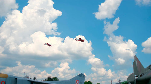 Low angle view of airplane flying in sky