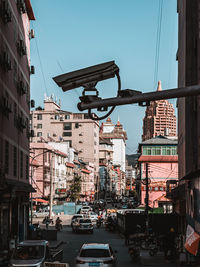 City street and buildings against sky