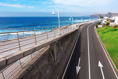 Bridge over sea against sky