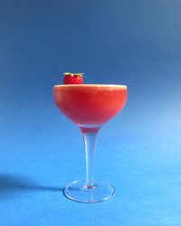 Close-up of drink on blue glass