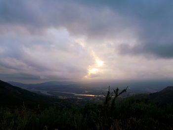 Scenic view of dramatic sky over land