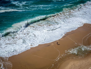 High angle view of surf on beach