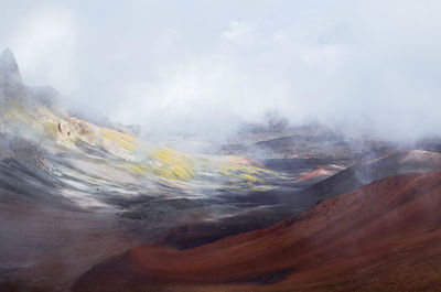 Scenic view of volcanic landscape against sky