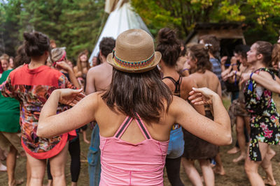 Rear view of people enjoying music concert