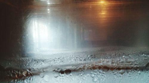 Close-up of raindrops on glass window