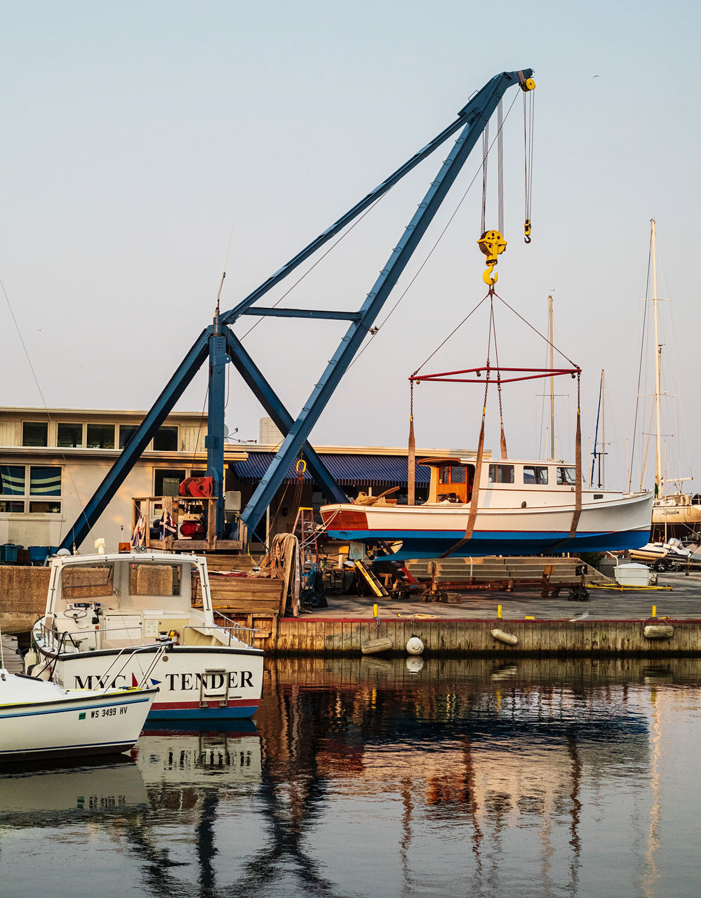 water, transportation, nautical vessel, vehicle, mode of transportation, architecture, harbor, port, boat, dock, pier, sky, sea, no people, nature, crane - construction machinery, ship, reflection, built structure, commercial dock, watercraft, machinery, industry, outdoors, transport, day, moored, marina, mast, waterfront, city