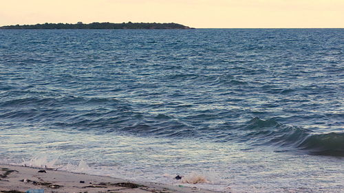 Scenic view of sea against clear sky