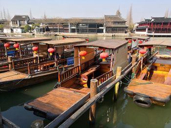 High angle view of boats moored in canal amidst buildings in city