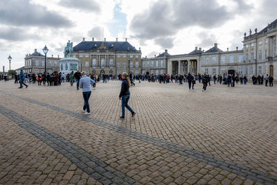 Group of people in front of historical building