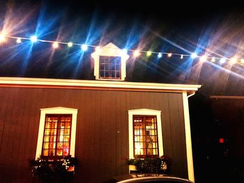 Low angle view of illuminated building at night