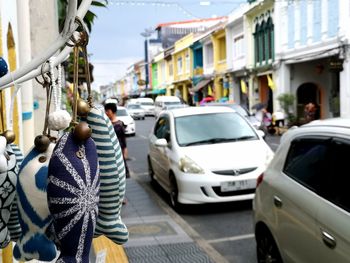 Rear view of people on street in city