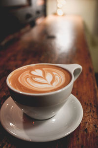 High angle view of coffee on wooden table