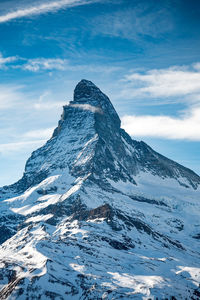 Scenic view of snowcapped mountain against sky