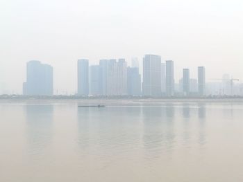 View of modern buildings in city against sky