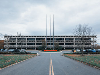 Road by city against sky