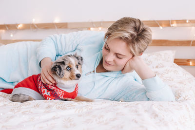 Cute dog lying on bed