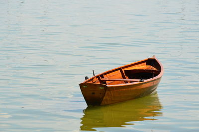 Boat moored on lake