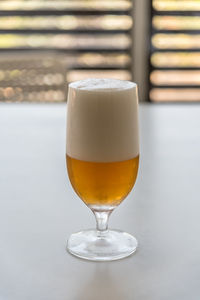 Close-up of beer in glass on table