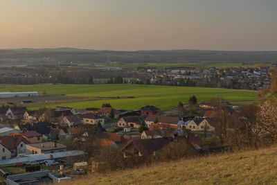 High angle view of houses and buildings against sky