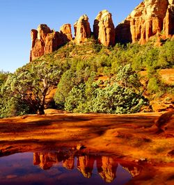 Scenic view of mountains against blue sky