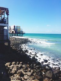 Scenic view of beach against clear sky