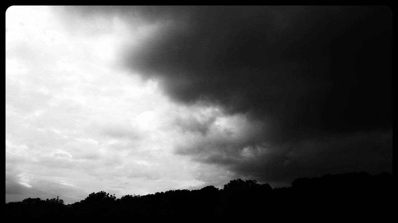 transfer print, sky, silhouette, auto post production filter, cloud - sky, cloudy, low angle view, tranquility, beauty in nature, tranquil scene, scenics, tree, nature, cloud, overcast, weather, dusk, storm cloud, outdoors, cloudscape