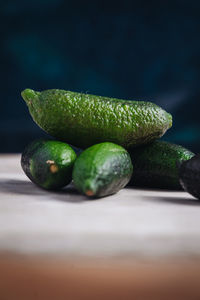 Close-up of green fruits on table