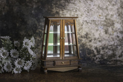 Antique wooden cabinet with mirror and drawers