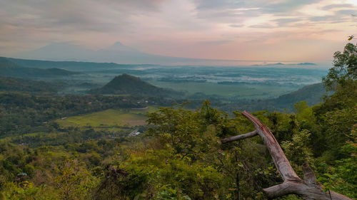 Scenic view of landscape against sky during sunset