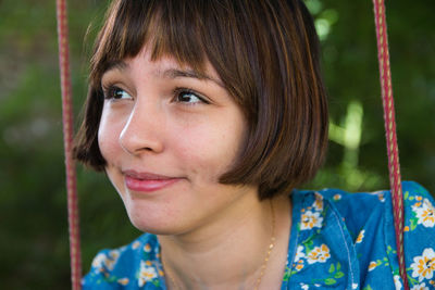 Close-up portrait of teenage girl smiling