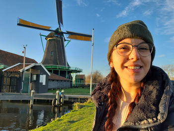 Woman winter tourist holiday in zaanse schans in netherlands