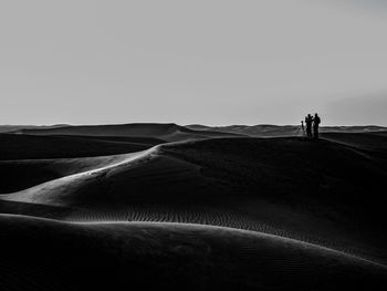 Scenic view of desert against clear sky