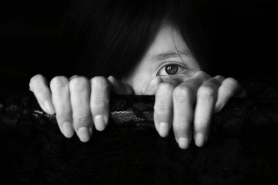 Close-up of man over black background