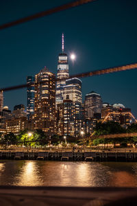 Illuminated buildings in city at night