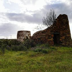 Old building against cloudy sky