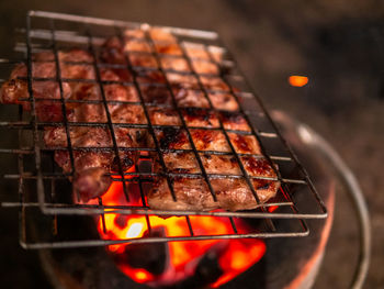 Close-up of meat on barbecue grill