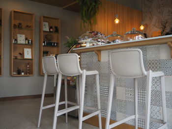 Empty chairs and table in restaurant