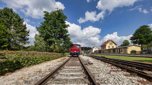 Train on railroad tracks against sky