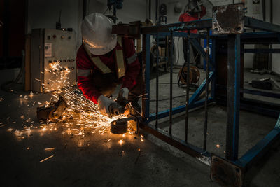 Rear view of man working at construction site