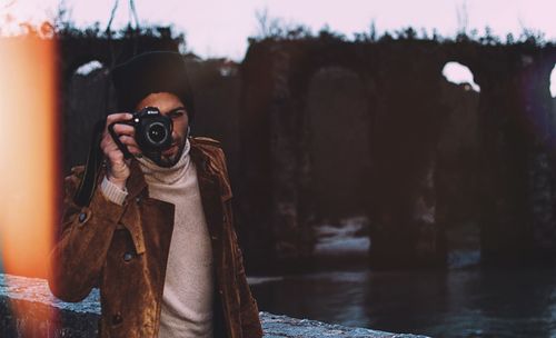 Man photographing self in reflection