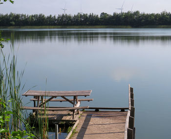 Pier over lake against sky