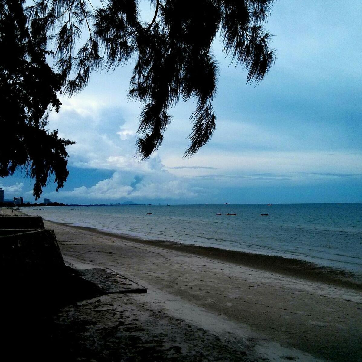 sea, beach, sky, horizon over water, tranquil scene, tranquility, water, shore, scenics, beauty in nature, cloud - sky, nature, sand, tree, cloud, idyllic, cloudy, coastline, calm, outdoors